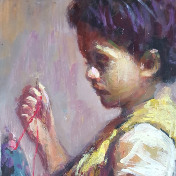 Little girl sewing