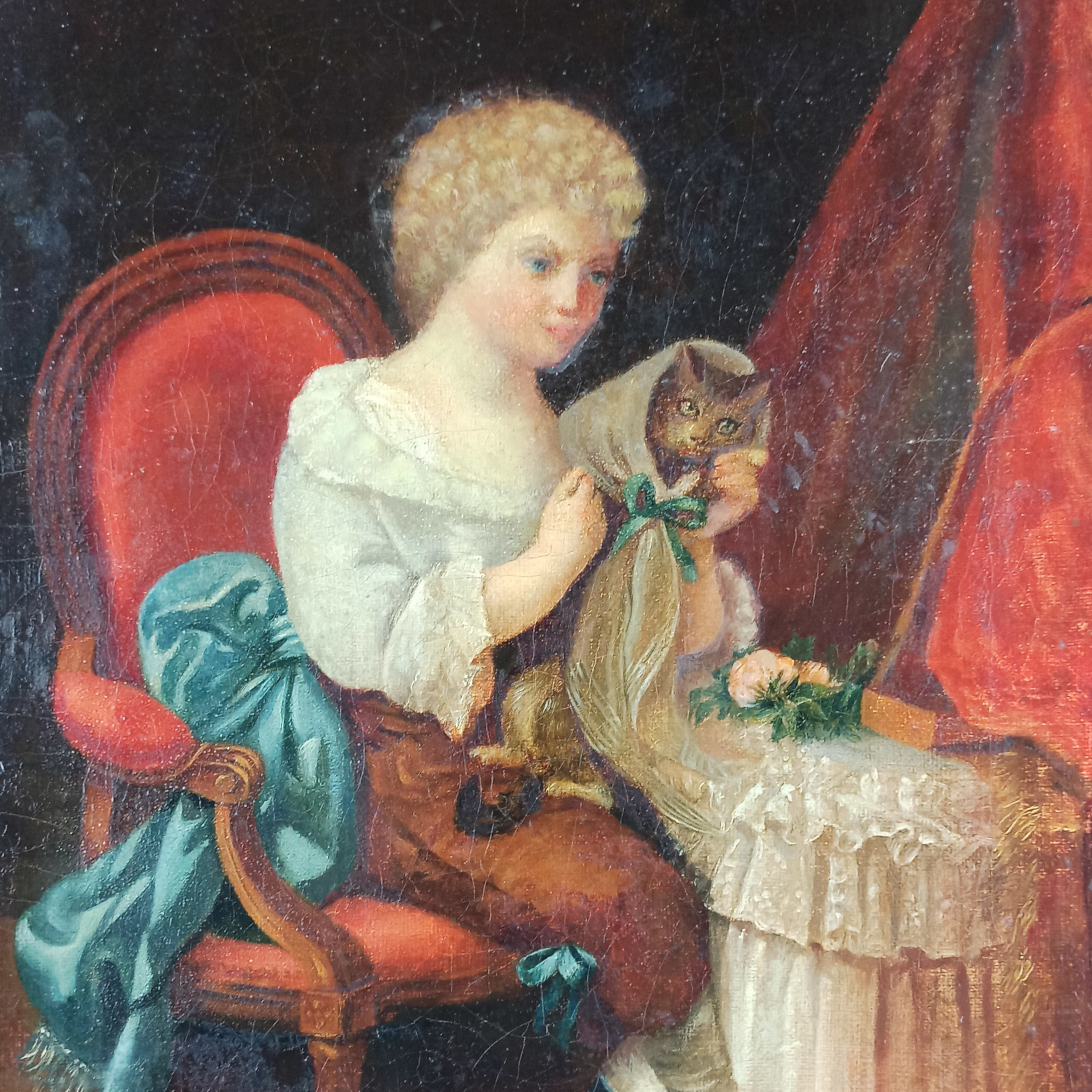 Child sitting with his cat