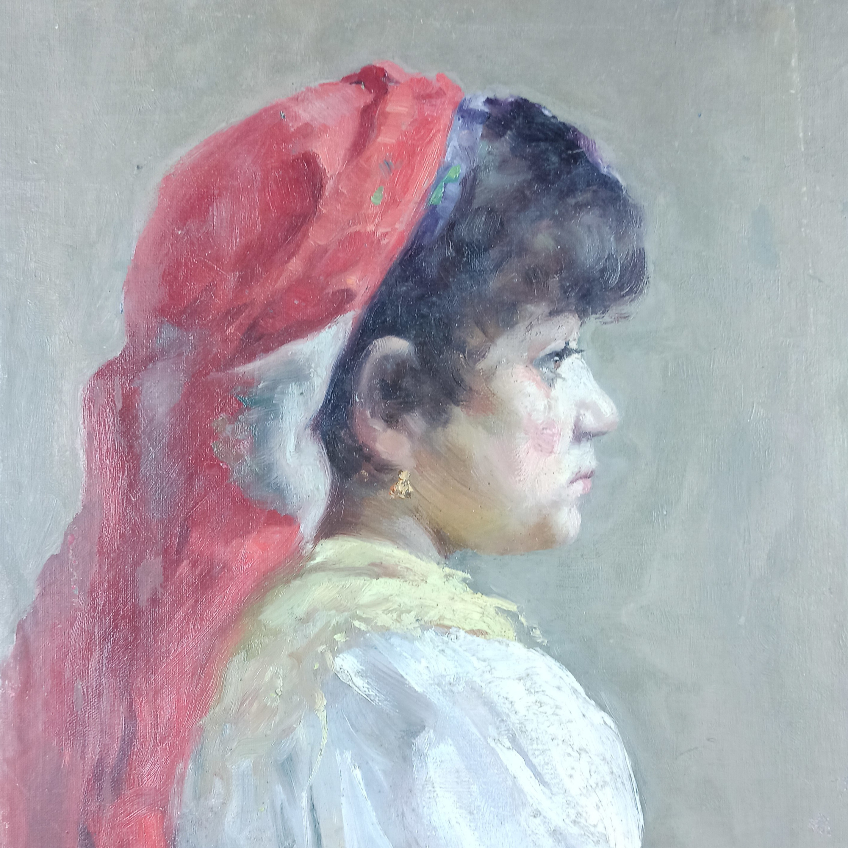 Portrait of a girl with a red headscarf